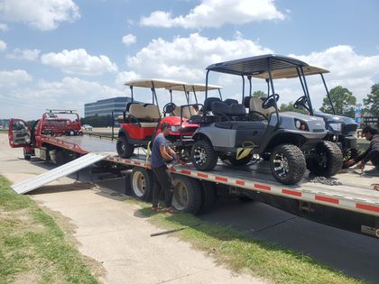Golf carts loaded for flatbed transport